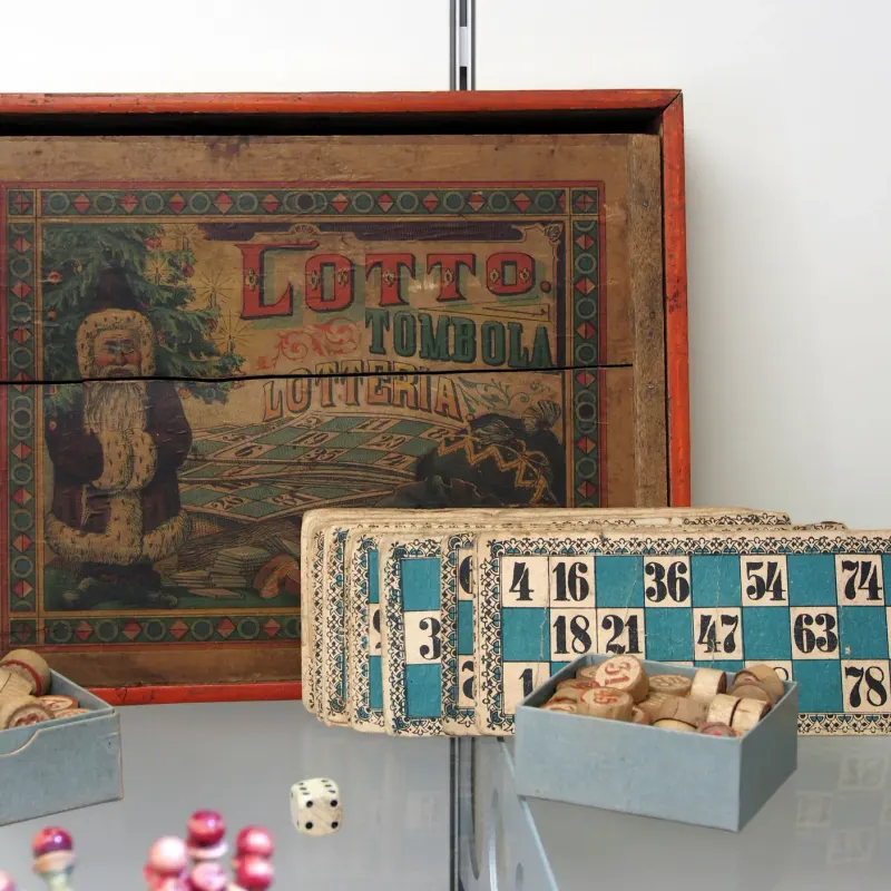Vintage lotto game box with numbered cards and wooden number tokens