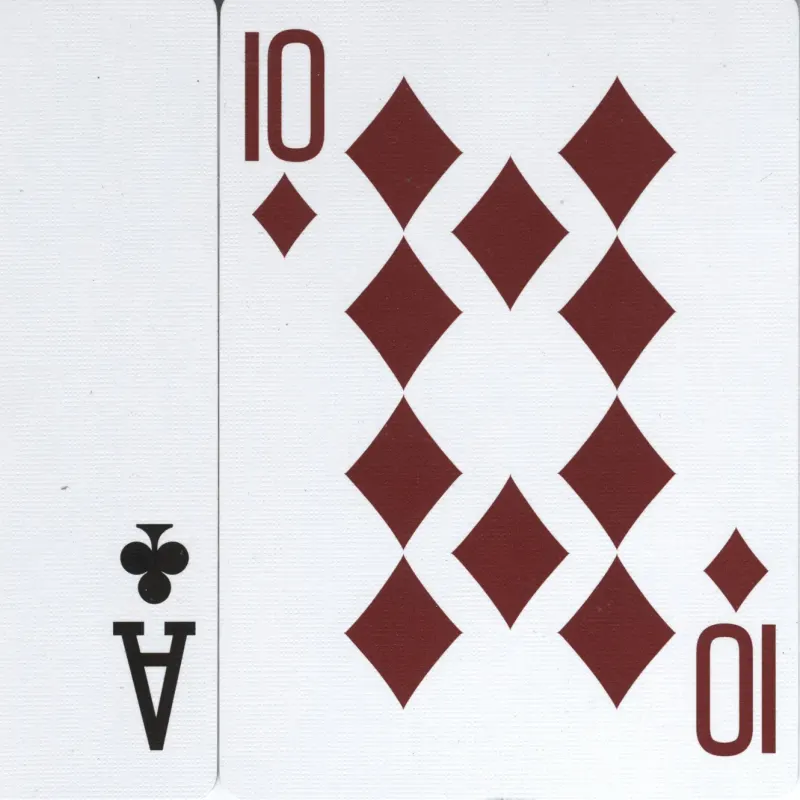 Ace of clubs and ten of diamonds forming a blackjack hand